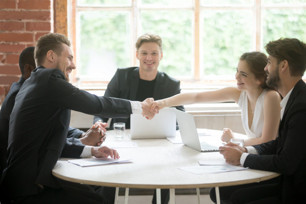 Colleagues meeting across a desk